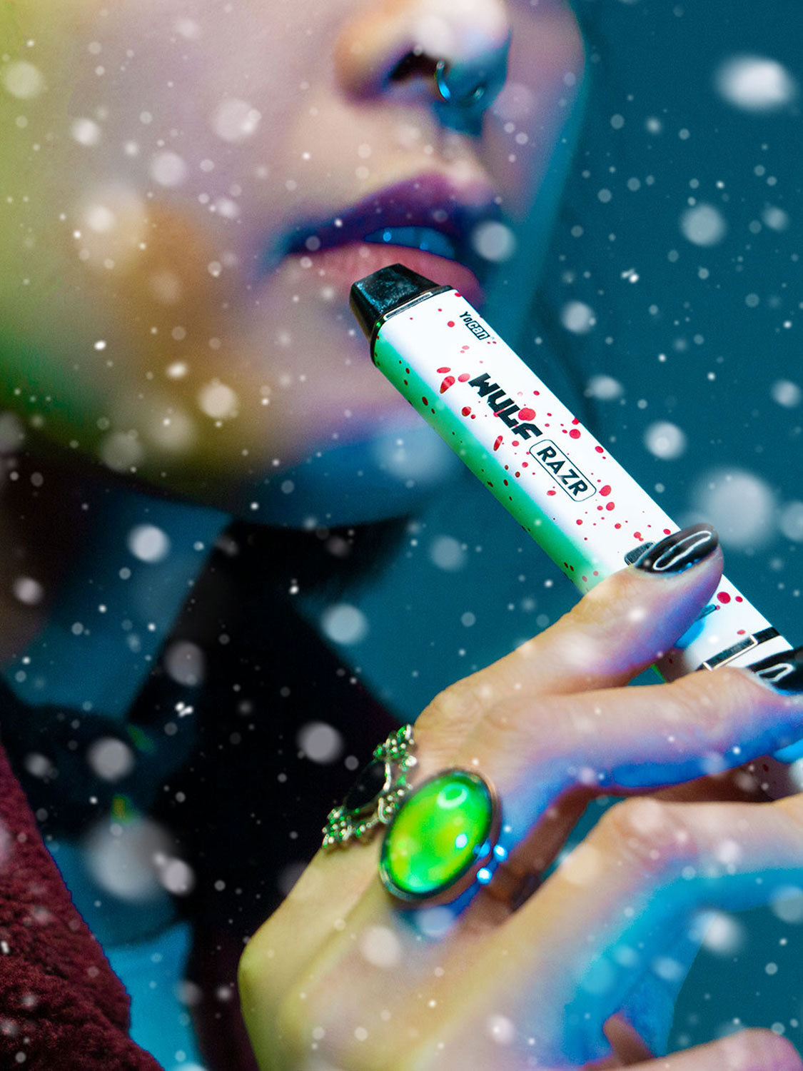 Woman holding Wulf RAZR in front of blue studio background with snow falling