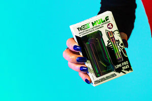 Woman holding Wulf UNI Pro Max in front of blue studio background